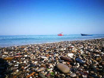 Scenic view of sea against clear blue sky