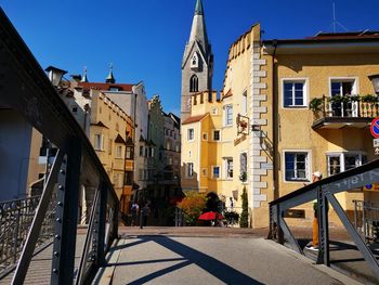 View of buildings in town against sky