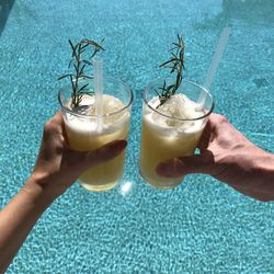 Midsection of man holding ice cream in swimming pool