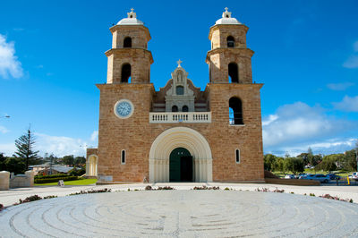 Facade of historic building against blue sky