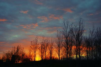 Scenic view of dramatic sky at sunset