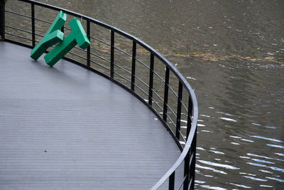 High angle view of railing in water