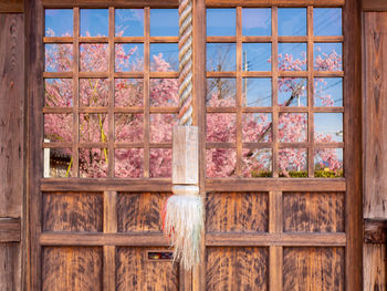 Low angle view of glass window of building