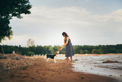 Man with dog on beach