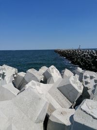 Scenic view of sea against clear blue sky