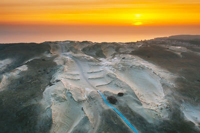 Aerial view of landscape against sky during sunset