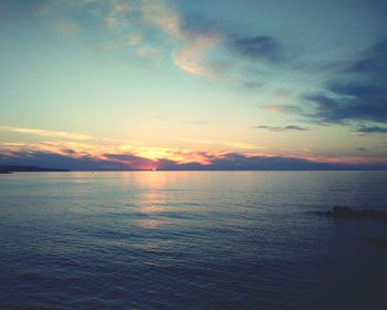 Scenic view of sea against sky at sunset