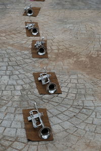 High angle view of old telephone on footpath