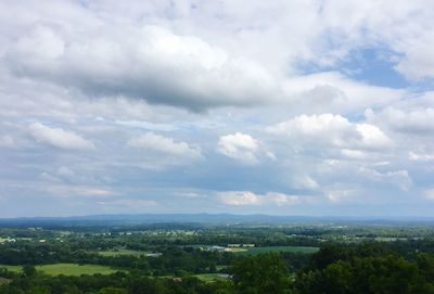 Scenic view of landscape against cloudy sky