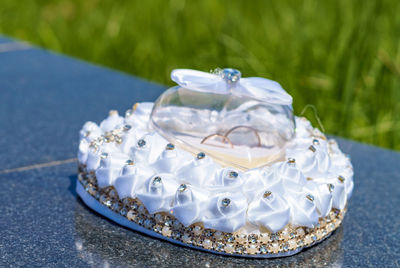 Close-up of wedding rings on table