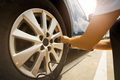 Cropped image of man repairing car