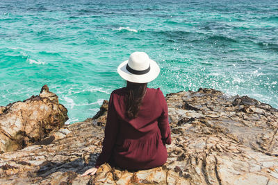 Rear view of woman looking at sea