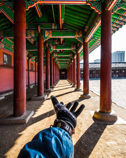 Cropped hand of man at temple