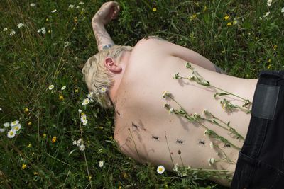 High angle view of woman lying down on land