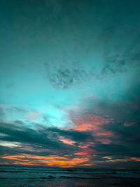 Low angle view of dramatic sky during sunset