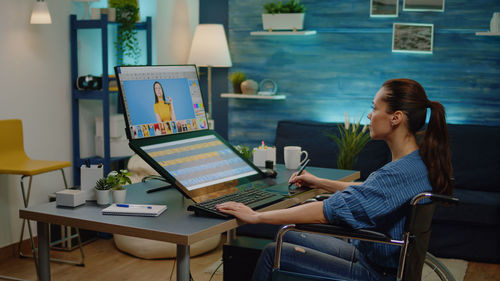 Woman using laptop at home