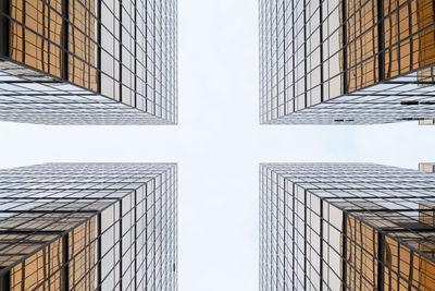 Low angle view of modern buildings against sky