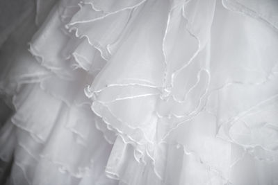 Close-up of frills on wedding dress