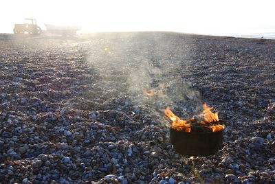 View of burning barbecue on beach