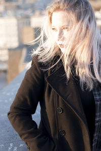 Close-up of woman standing on snow