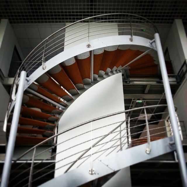 architecture, built structure, low angle view, railing, modern, building exterior, steps, steps and staircases, transportation, indoors, staircase, building, day, high angle view, no people, part of, escalator, cropped, connection