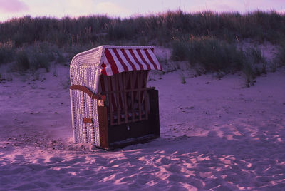 Hooded beach chair on snow covered field