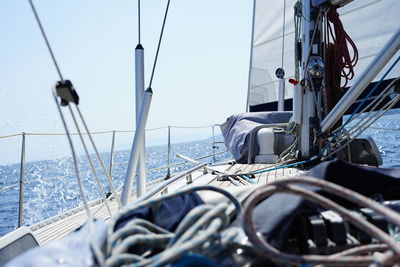 Sailboat sailing in sea against sky