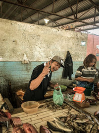 People at market stall