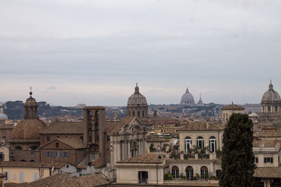 Cathedral and buildings in city against sky