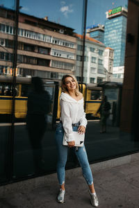 Full length of woman on street in city