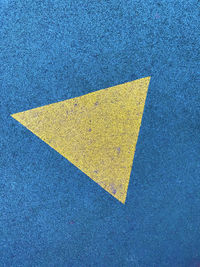 High angle view of yellow marking on road