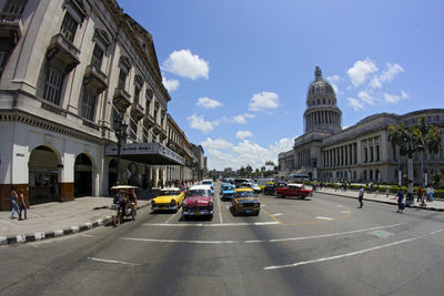 City street against cloudy sky