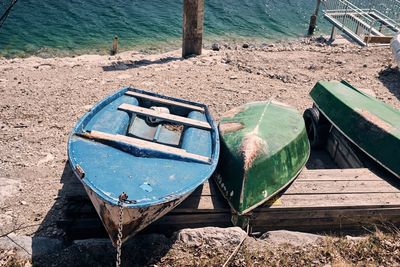 High angle view of abandoned boats moored at beach