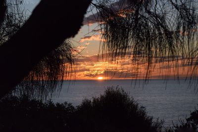 Scenic view of sea against sky at sunset