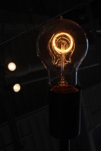Low angle view of illuminated light bulb