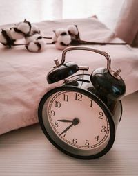 Close-up of clock on table