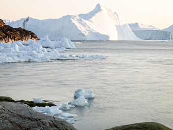 Scenic view of glacier against sky