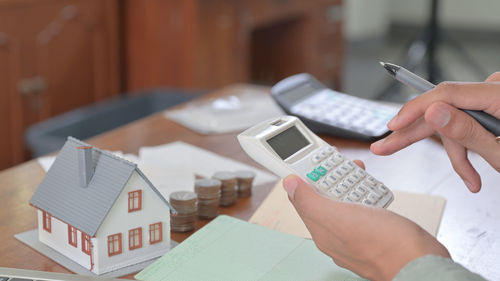 High angle view of man using smart phone on table