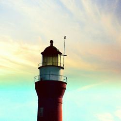 Low angle view of lighthouse against cloudy sky