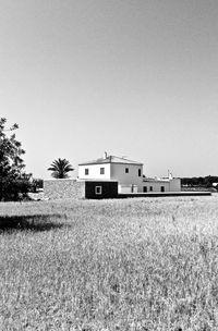 Built structure on field against clear sky