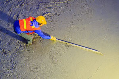 High angle view of man working with umbrella