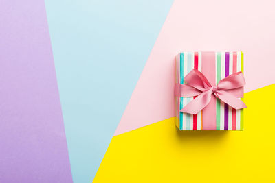 High angle view of gift box against blue background