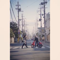 People on road in city