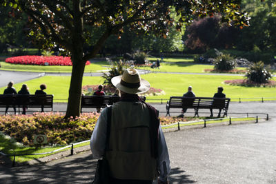 Rear view of men standing in park