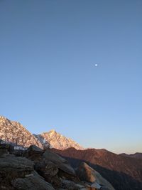 Scenic view of mountains against clear blue sky