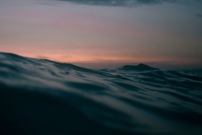 Scenic view of sea against dramatic sky