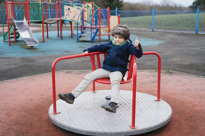 Full length of boy playing at playground