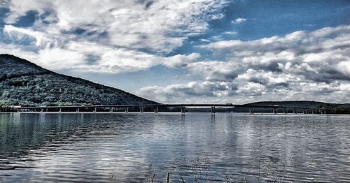 View of calm sea against cloudy sky