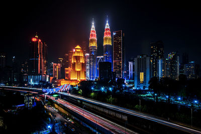 High angle view of illuminated buildings in city at night