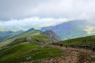 Scenic view of landscape against cloudy sky